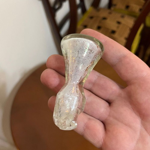 Vintage glass pitcher used with red decorative details