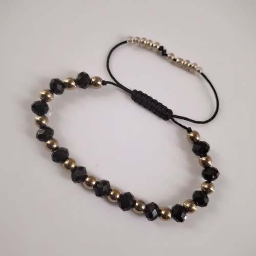 Handmade bracelet with black crystals and gold hematite beads, adjustable cord