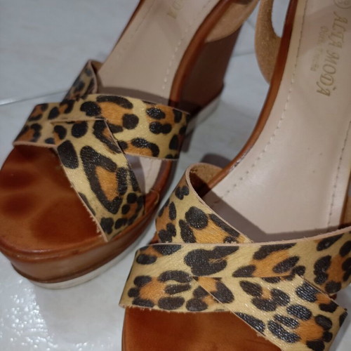Tan platforms with animal print used, size 38