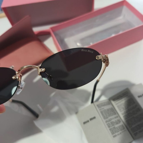 Miu Miu sunglasses women like new, black and gold