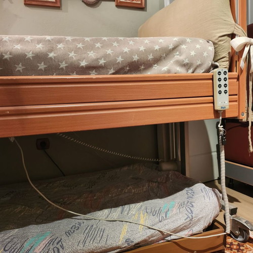 Electric hospital bed used with headboard