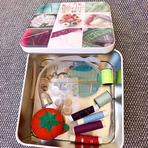 Sewing kit metal box with useful sewing items used