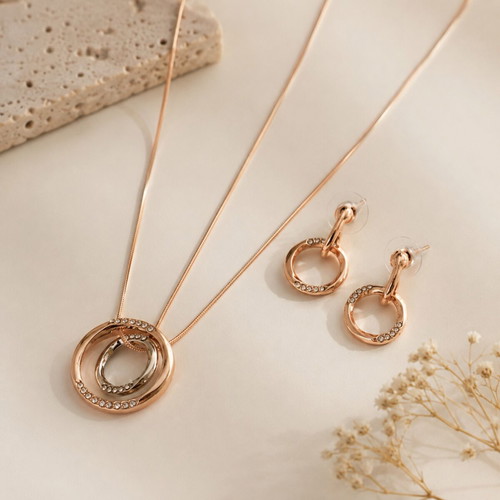 Jewelry set in rose gold with sparkling stones like new