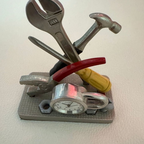Decorative tabletop clock like new with tools theme