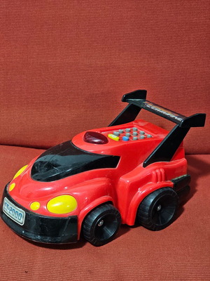 Toy car used with programmable functions, missing battery cover