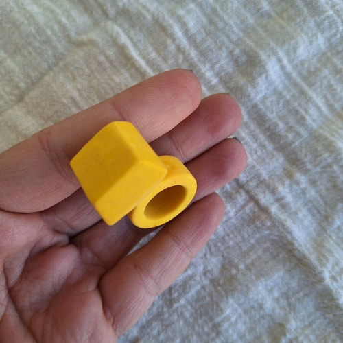 Yellow eraser in ring shape like new