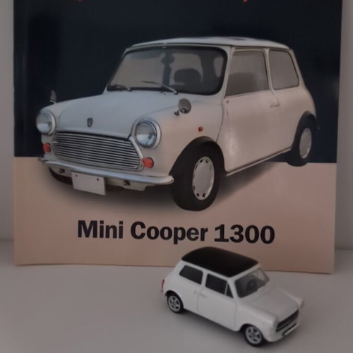 Mini Cooper 1300 collectible with booklet and diecast model like new