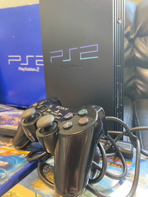 PlayStation 2 κονσόλα σαν καινούργιο με 7 παιχνίδια, χειριστήριο, καλώδια και memory card