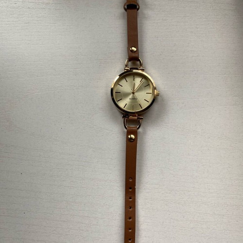 Avon women's watch like new, gold with brown strap