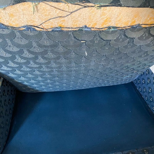 Classic armchair used with wear, needs reupholstery