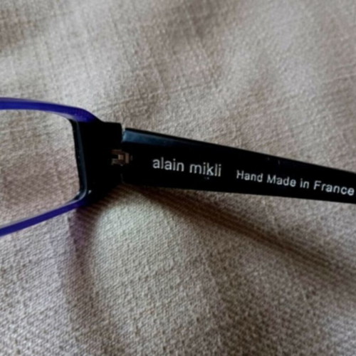 Alain Mikli eyeglasses used with hard case, black and purple