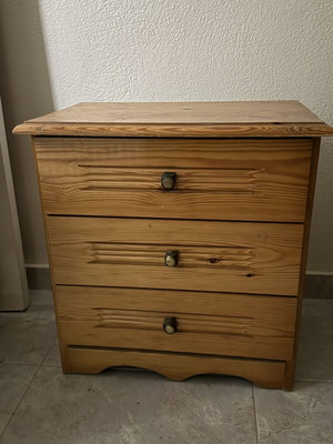 Wooden nightstand used with three drawers, classic design