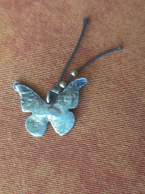 Silver butterfly pendant used