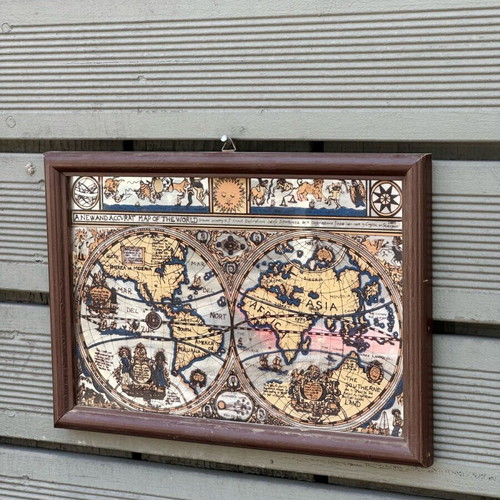 Decorative mirror with antique world map used, wooden frame
