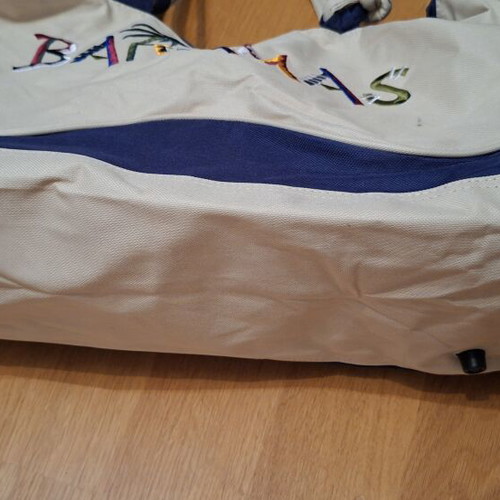 Beige fabric beach bag with colorful embroidered Bahamas lettering