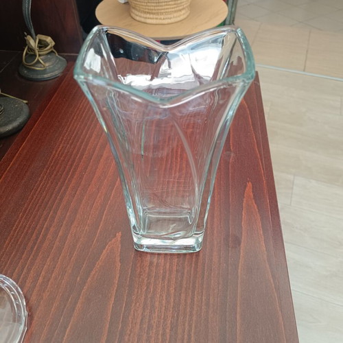 Glass decorative vase with modern wavy design, used