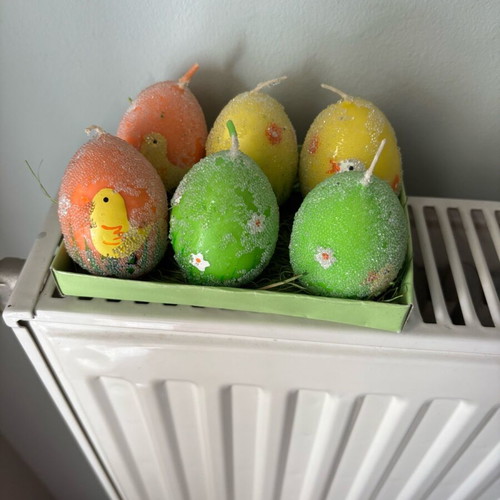 Easter candles shaped like eggs like new, painted