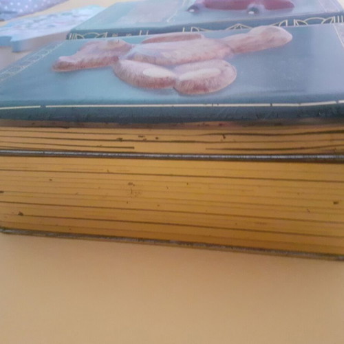 Collectible metal storage box in book style like new