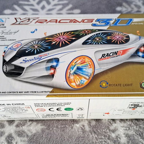 Racing car new with motion, music and lights