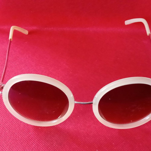 Sunglasses used, beige color