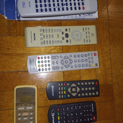 Set of 7 different TV remote controls