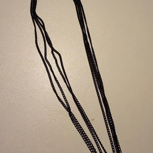 Pendant like new metal with 4-row black and gold chain with rhinestones