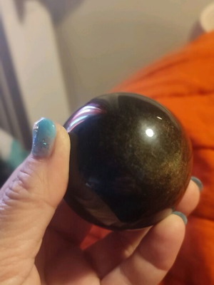 Black crystal ball with cat eye effect new with stand