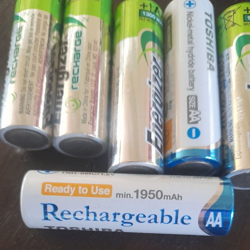 Rechargeable AA batteries with 4-slot charger like new