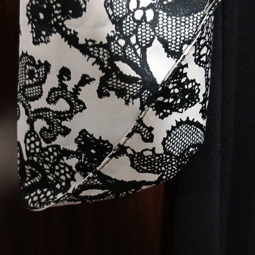 Unique women's dress with lace print design, size 2