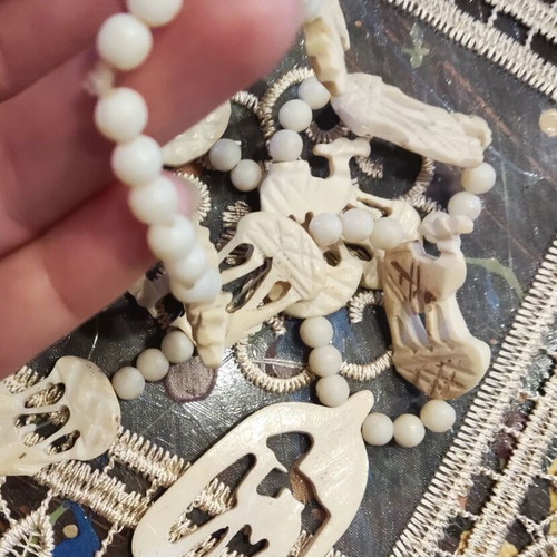 Vintage bone necklace with elephants used