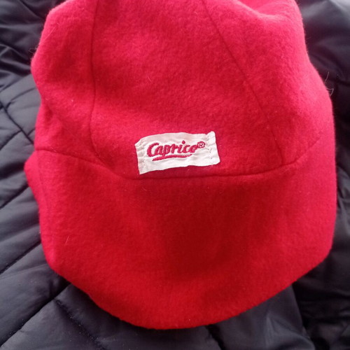 Red knitted Caprice hat slightly used