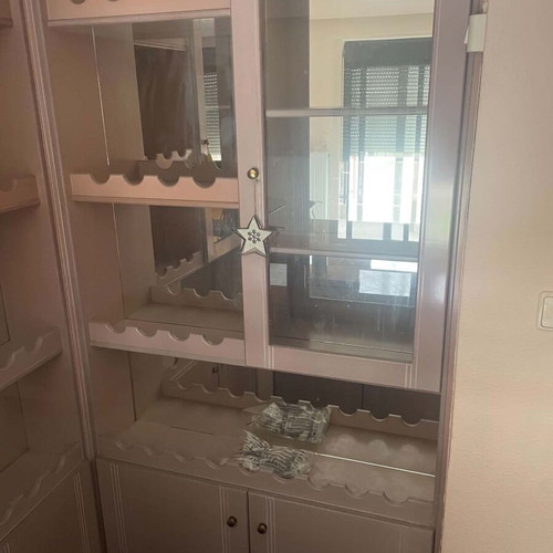 Mini bar like new with mirrors, cabinets, and carpeted floor
