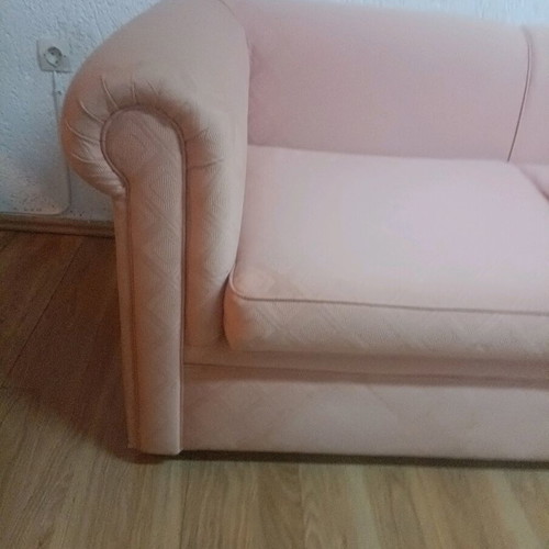 Vintage two-seater sofa used, salmon color in very good condition