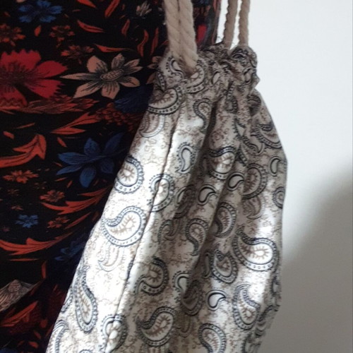 Drawstring backpack with paisley pattern and gold details, new