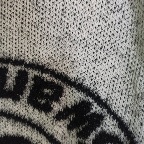 Women's cardigan like new, black and white with two pockets