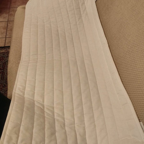 IKEA crib mattress pad used with stain