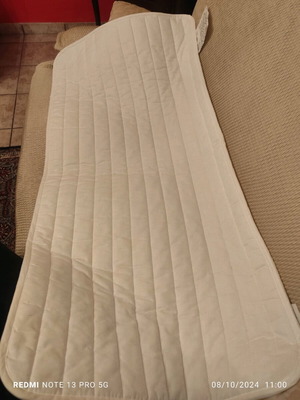 IKEA crib mattress pad used with stain