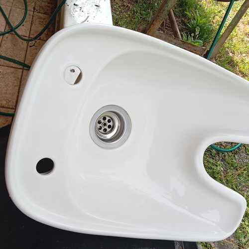 White porcelain hair salon sink used