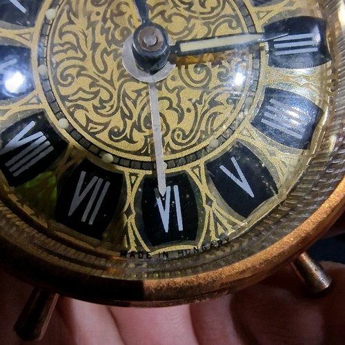 Winding table clock used for repair