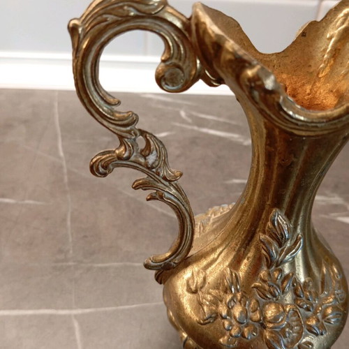 Metal container used with embossed design and handle