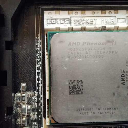 Asus M4A79T Deluxe motherboard used with CPU, fan and 16GB RAM