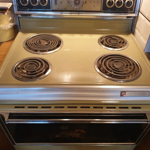 Vintage 1970s home appliance set used, General Electric fridge, Kenmore stove, Ariston washer