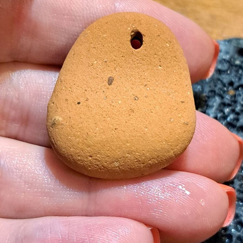 Natural raw stones like new, oval terracotta and textured gray