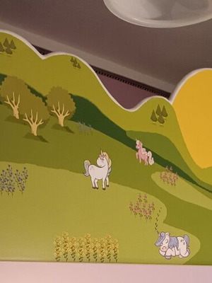 Bunk bed protective panel used, plywood with unicorn stickers