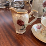 Vintage porcelain tea set with flowers and gold details, like new