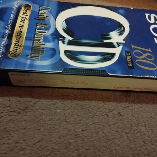 Video cassette used with Love Shots sticker from Elefthero Theatro