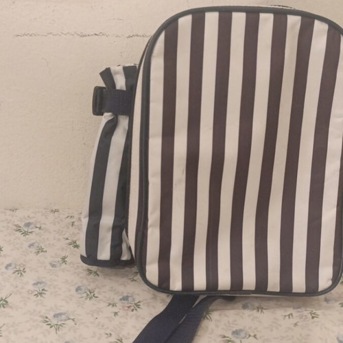 Insulated backpack with bottle holder like new, black and white striped