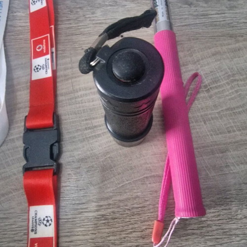 Flashlight, selfie stick and three keychain lemus used