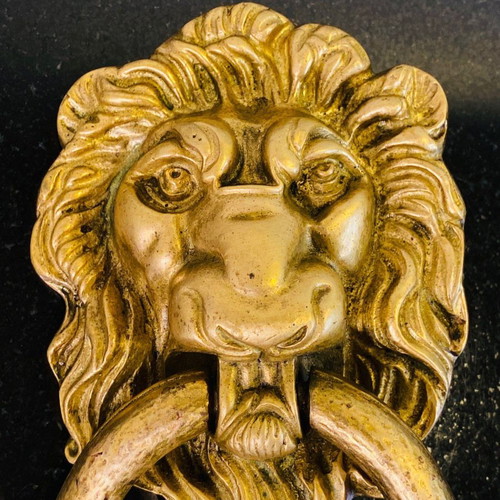 Bronze door knocker used with lion head and wooden base