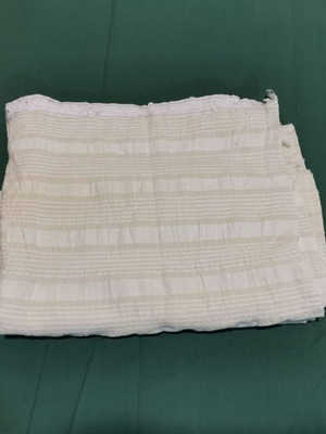 Woven bed sheet used with signs of age from 1930 era